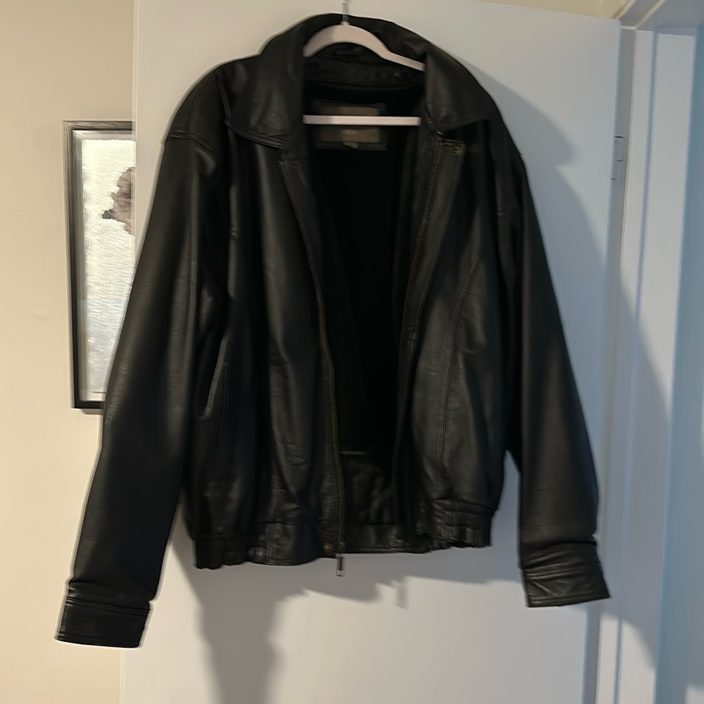 Leather, lined jacket, size large. Lining comes out by way of zipper.